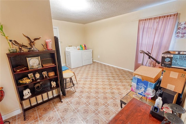 interior space with washer and dryer and a textured ceiling