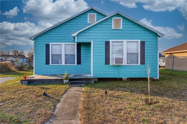 bungalow with a front lawn