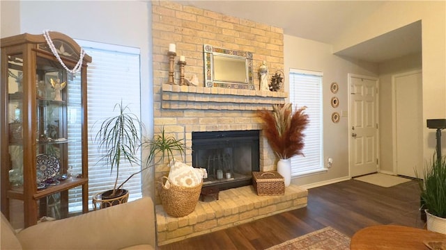 3014 Quail Spgs # D5, Corpus Christi, TX 78414 - living room with vaulted ceiling, wood finished floors, a brick fireplace, and baseboards