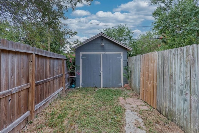 view of shed featuring a fenced backyard