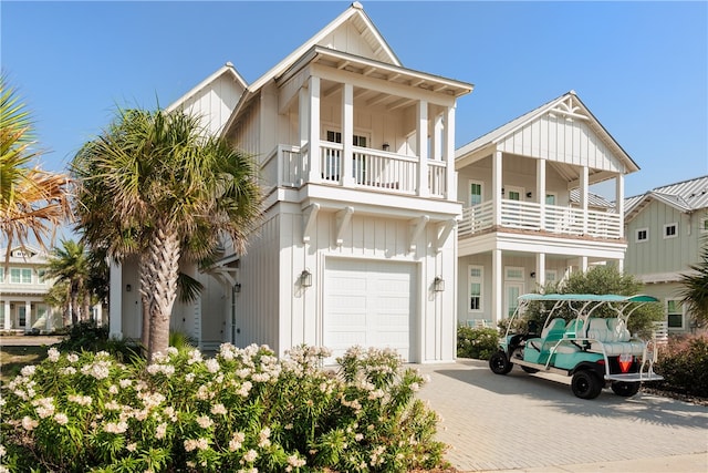 view of front facade with a balcony and a garage