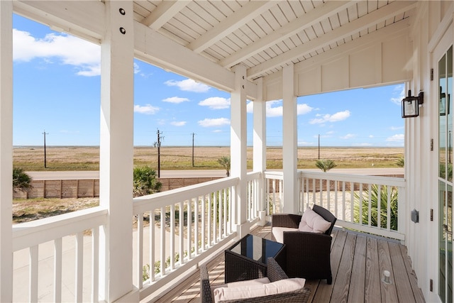 wooden terrace featuring a rural view