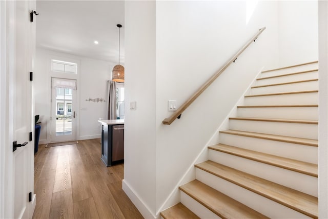 staircase featuring wood-type flooring