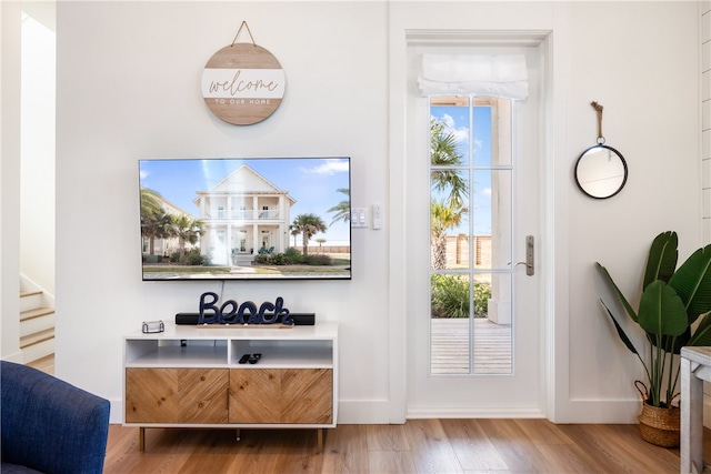 entryway with hardwood / wood-style flooring