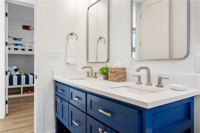 bathroom with vanity and wood-type flooring