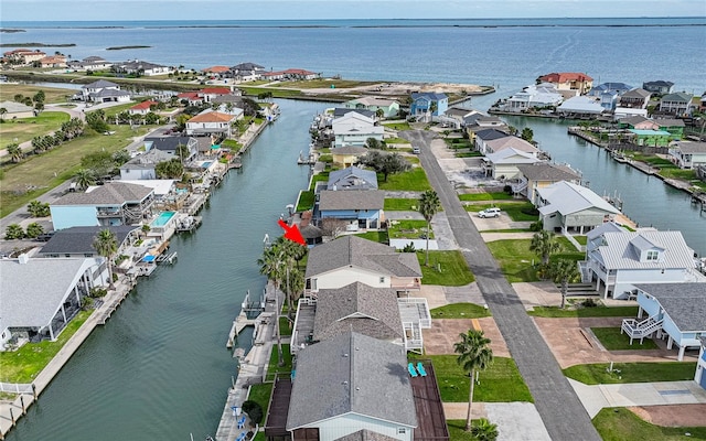 drone / aerial view with a water view