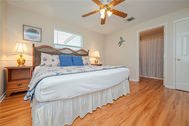 bedroom with hardwood / wood-style floors and ceiling fan