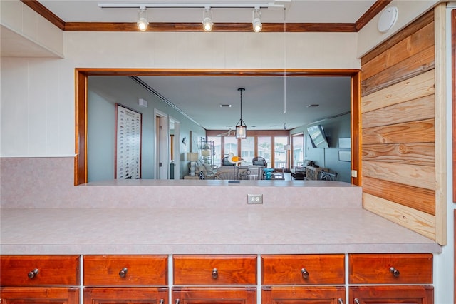 kitchen with rail lighting and crown molding