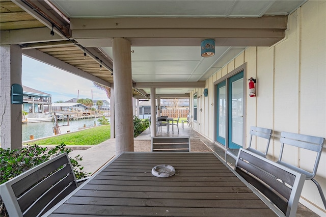 exterior space featuring a patio and a water view