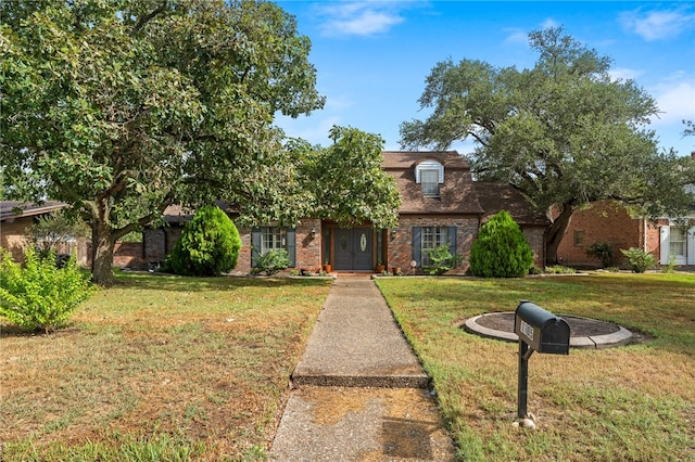 view of front of property with a front lawn