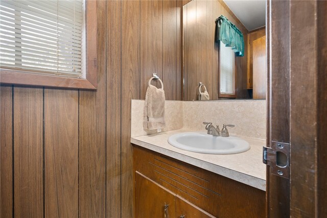 bathroom featuring backsplash and vanity