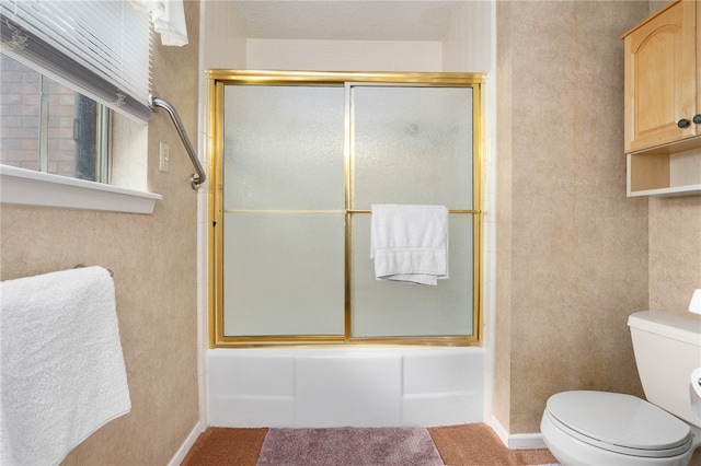 bathroom with toilet and enclosed tub / shower combo