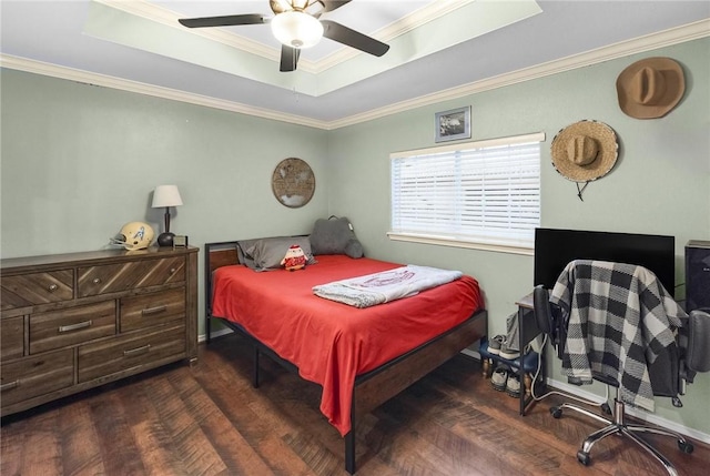 bedroom featuring a raised ceiling, ceiling fan, and crown molding