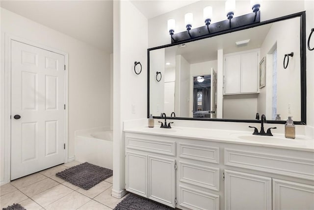 bathroom with tile patterned flooring and vanity