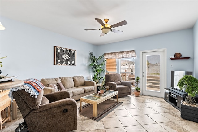 living room featuring light tile patterned floors and a ceiling fan