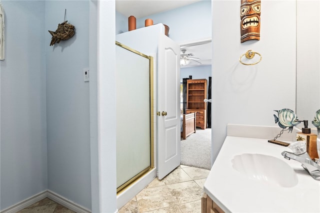 bathroom with a stall shower, vanity, and tile patterned floors