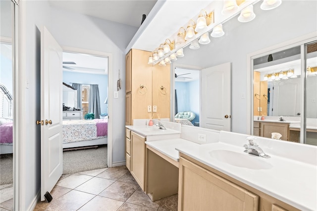 full bath with tile patterned floors, ceiling fan, vanity, and ensuite bathroom