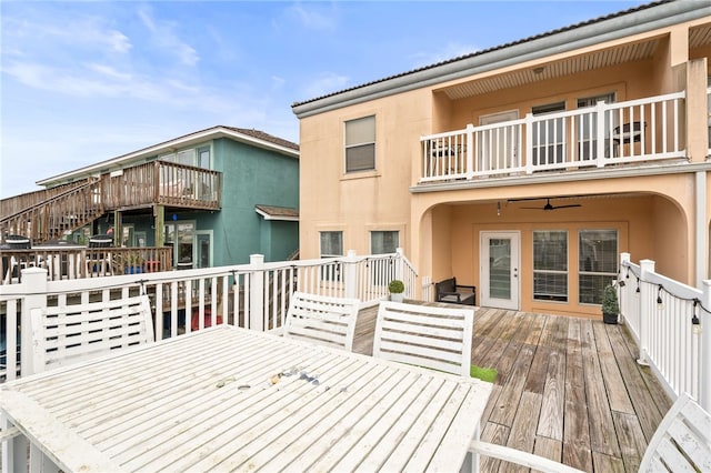 wooden deck featuring ceiling fan