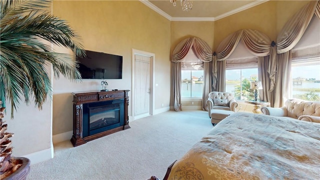 153 E Tuscany Way, Port Oconnor, TX 77982 - carpeted bedroom with ornamental molding, a chandelier, baseboards, multiple windows, and a glass covered fireplace