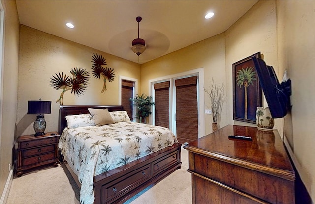 bedroom featuring ceiling fan and light colored carpet