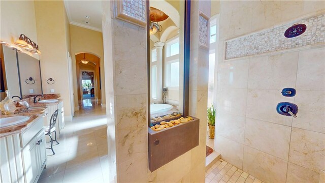 153 E Tuscany Way, Port Oconnor, TX 77982 - full bathroom featuring ornamental molding, double vanity, a garden tub, tile patterned flooring, and walk in shower