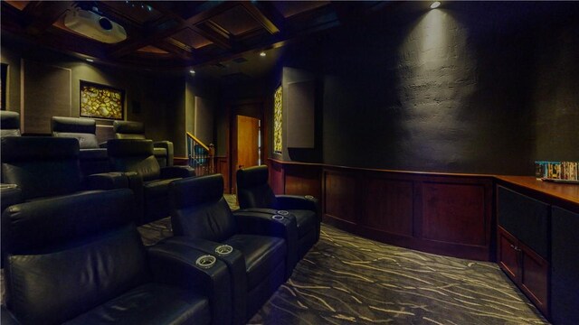 153 E Tuscany Way, Port Oconnor, TX 77982 - carpeted cinema room featuring coffered ceiling, beamed ceiling, and wainscoting