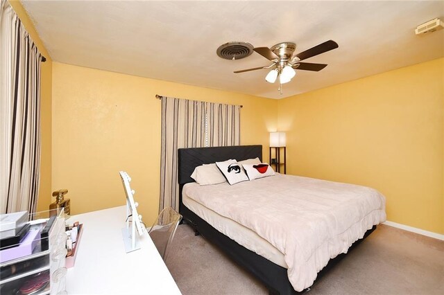 carpeted bedroom with ceiling fan