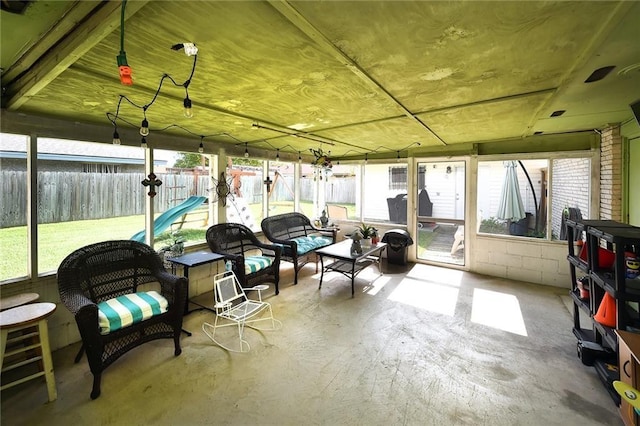 sunroom / solarium featuring plenty of natural light