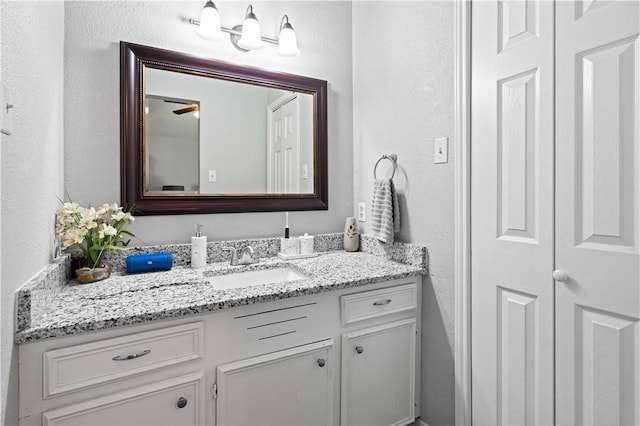 3029 White Bird Dr, Corpus Christi, TX 78415 - bathroom featuring vanity and a textured wall