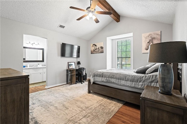3029 White Bird Dr, Corpus Christi, TX 78415 - bedroom featuring light wood-style floors, ensuite bathroom, a textured ceiling, and a ceiling fan