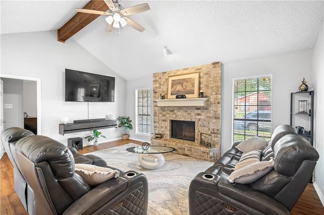 3029 White Bird Dr, Corpus Christi, TX 78415 - living area featuring wood finished floors, a ceiling fan, a fireplace, and baseboards