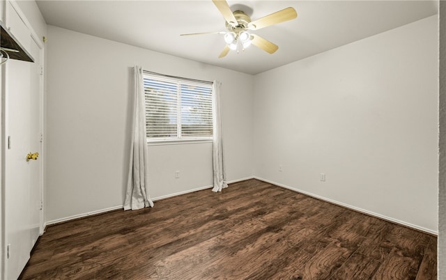 interior space with ceiling fan and dark hardwood / wood-style floors