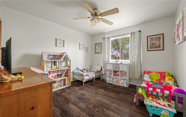 bedroom featuring ceiling fan and dark wood-type flooring