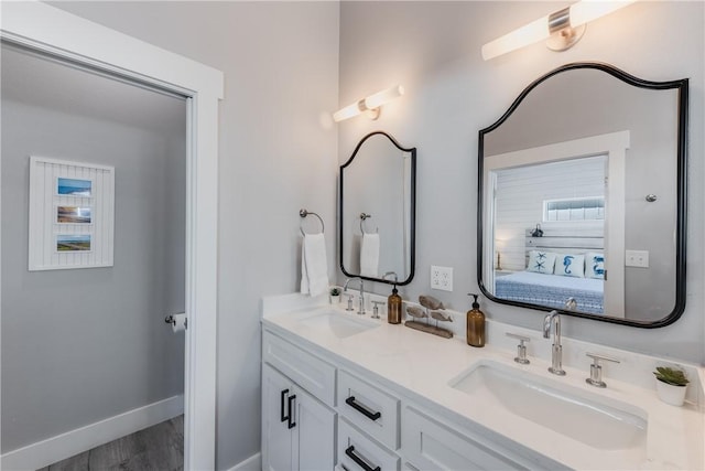 bathroom with vanity and hardwood / wood-style floors