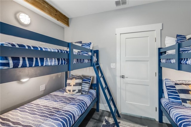 bedroom with beam ceiling