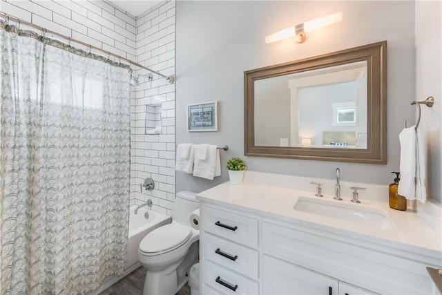 full bathroom featuring toilet, vanity, and shower / tub combo with curtain