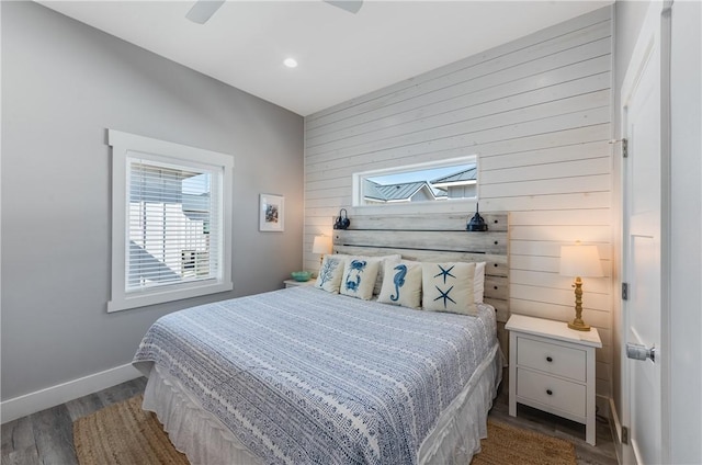 bedroom featuring ceiling fan and dark hardwood / wood-style flooring