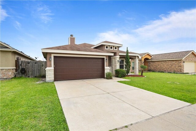 6930 Anastasia, Corpus Christi, TX 78413 - view of front of house featuring stone siding, an attached garage, stucco siding, and a chimney