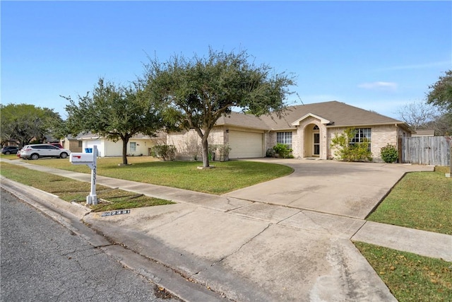 single story home featuring a garage and a front lawn