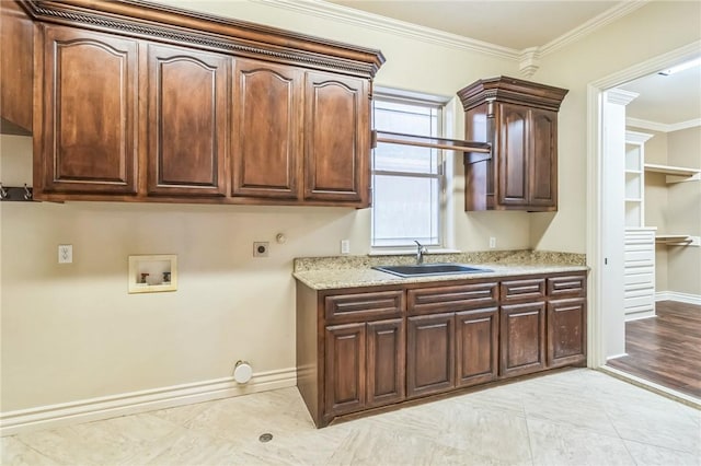 6522 Miranda Dr, Corpus Christi, TX 78414 - laundry room with cabinet space, washer hookup, baseboards, ornamental molding, and hookup for an electric dryer