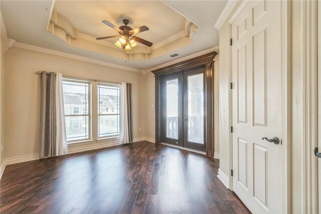 6522 Miranda Dr, Corpus Christi, TX 78414 - spare room featuring french doors, a raised ceiling, dark wood-style flooring, a ceiling fan, and baseboards
