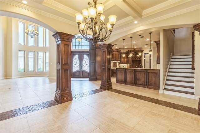 6522 Miranda Dr, Corpus Christi, TX 78414 - foyer with a chandelier, ornamental molding, stairs, light tile patterned floors, and beam ceiling
