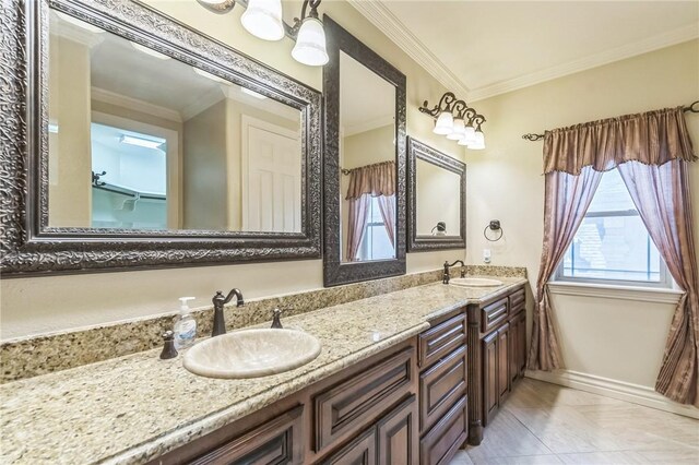 6522 Miranda Dr, Corpus Christi, TX 78414 - bathroom featuring double vanity, crown molding, and tile patterned flooring
