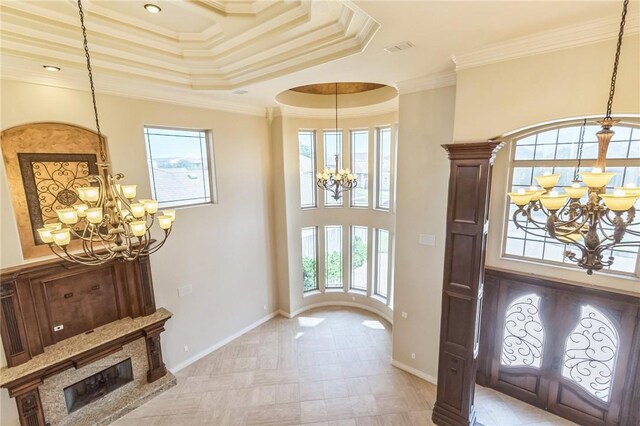 6522 Miranda Dr, Corpus Christi, TX 78414 - entrance foyer with a chandelier, a raised ceiling, crown molding, and baseboards