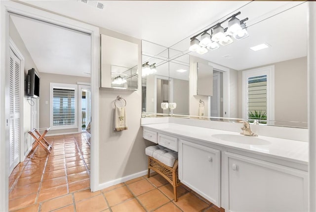 bathroom with tile patterned flooring and vanity