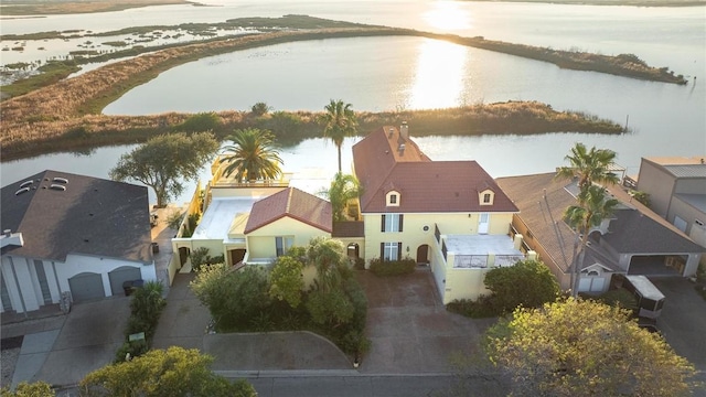 birds eye view of property with a water view