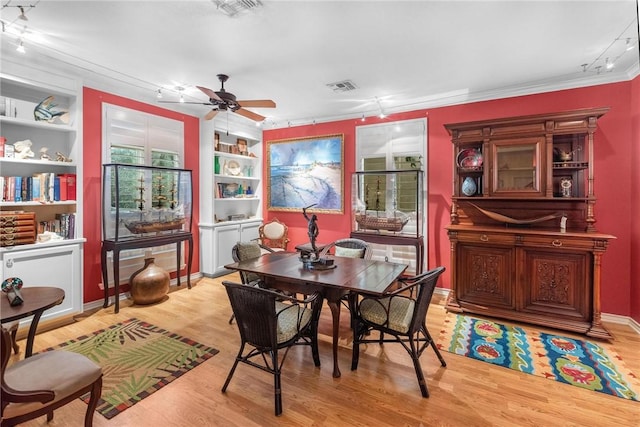 dining area with a healthy amount of sunlight, ceiling fan, light hardwood / wood-style floors, and track lighting