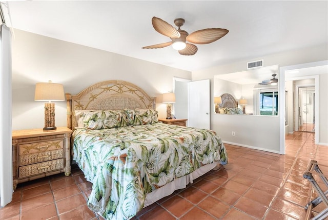 bedroom with tile patterned flooring and ceiling fan