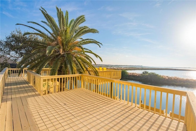 deck featuring a water view