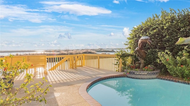 view of swimming pool featuring a deck with water view